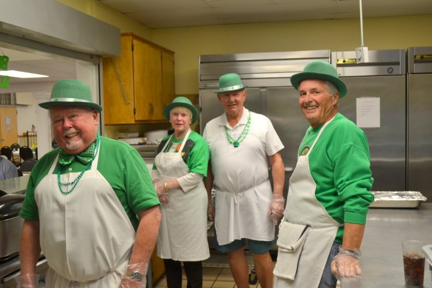 The St. Patrick's Day kitchen crew had the task of preparing the feast.  From left are Jim Stueve, Sue and Stan Burchacki and Dave Gibbons, all dressed for the day.