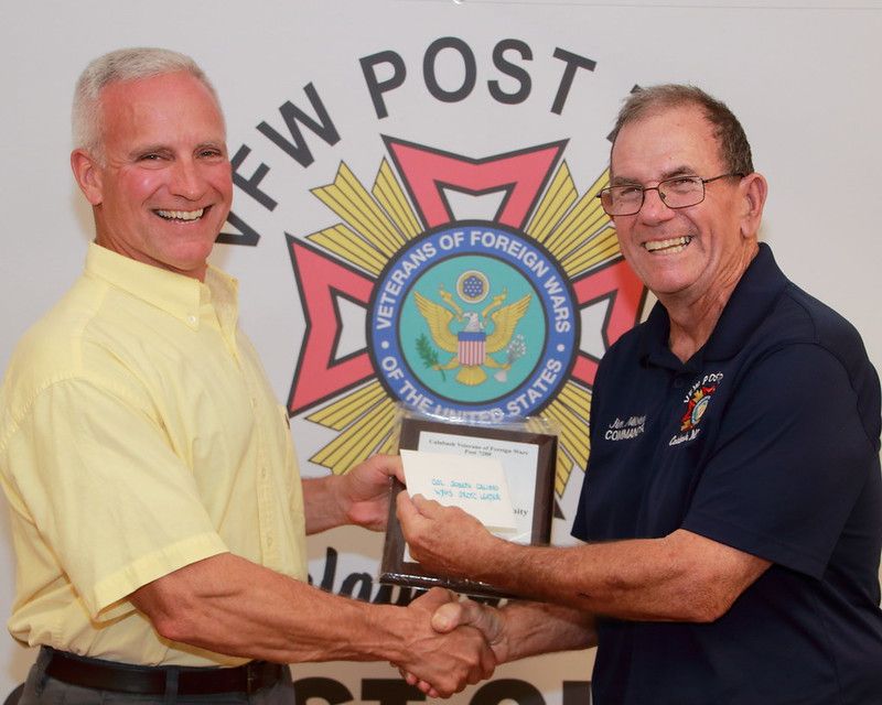 Jim Milstead, Commander of VFW Post #7288 presents the Distinguished Community Leader Award to Col Joseph Calisto, JROTC Instructor of West Brunswick High School on May 7th, 2022 in Calabash, NC.