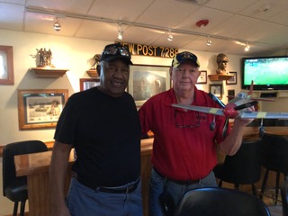Al Jackson presented the Post with a model that replicated the P51 Mustang Red Tails. These planes were flown by the Tuskegee Airmen. The Tuskegee Airmen were the first black military aviators.  These combat trained aviators flew more than 15,000 individual sorties in Europe and North Africa during WW II.
The plane is now in the canteen and being showcased with many other combat aircraft models built by Frank Pinkerton